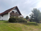 Hausansicht - Großzügiges Einfamilienhaus mit einem Traumgarten, Terrasse, Balkon, Garage und Solaranlage!